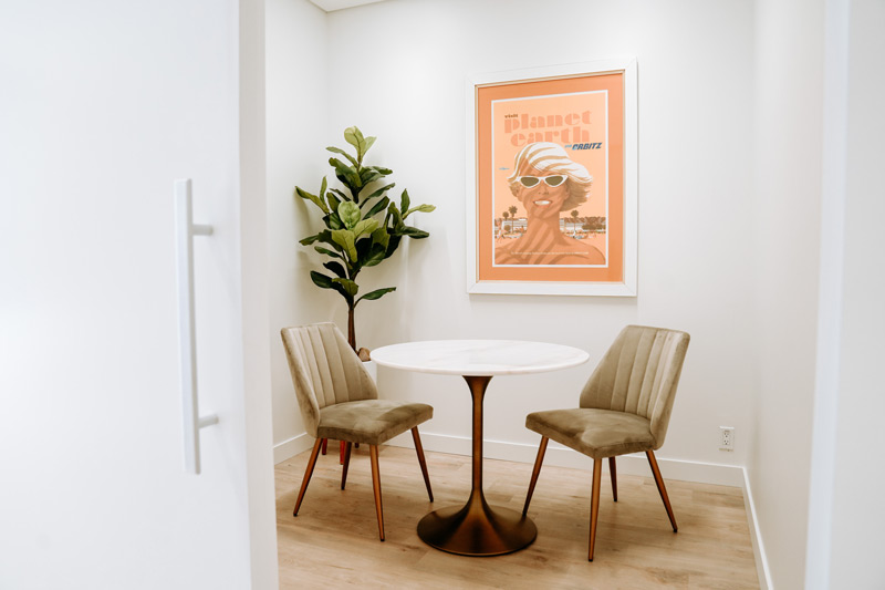 Small office with two chairs and a table for meeting in La Jolla Cosmetic Medical Spa in Carlsbad, CA